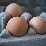 Selective Focus Photo of Three Eggs on Tray